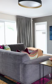 Family living with colourful cushions