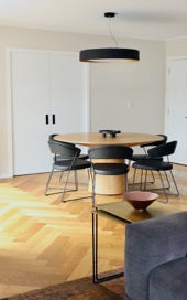  Round dining table with lighting above 
