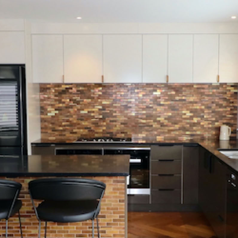 Studio 28 Interio Design Wellington Zealand. Creating wow interiors that are easy on the eye. Two tone kitchen with brass tiles.