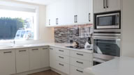 Kitchen benchtops with digitally printed glass splashback