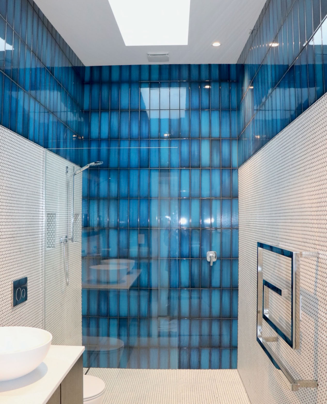 Studio 28 Interio Design Wellington Zealand. Creating wow interiors that are easy on the eye. Mesmerizing blue tiles with white penny tiles in new ensuite.