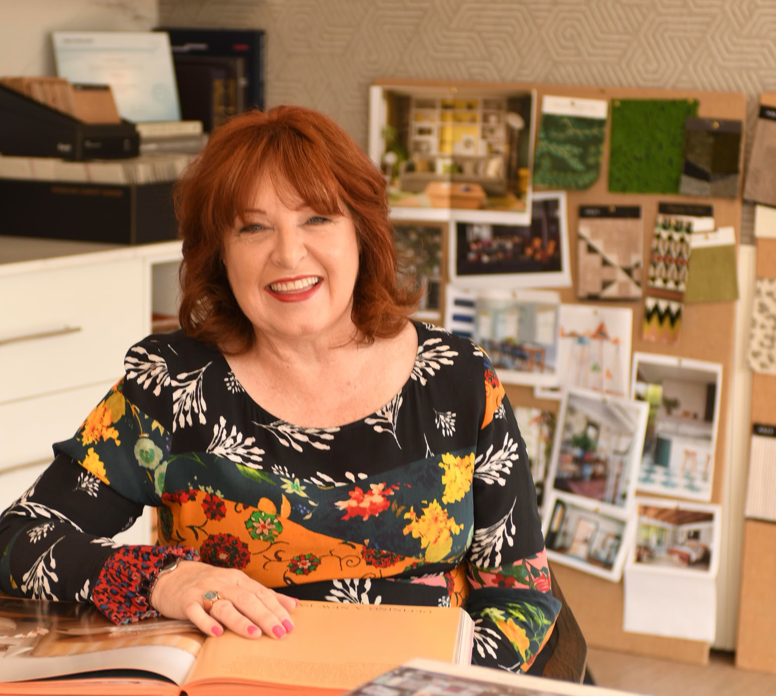 Studio 28 Interio Design Wellington Zealand. Creating wow interiors that are easy on the eye. Karyn Hopper sitting at table in interior design studio.