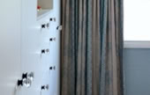 Bedroom storage and beautiful curtains
